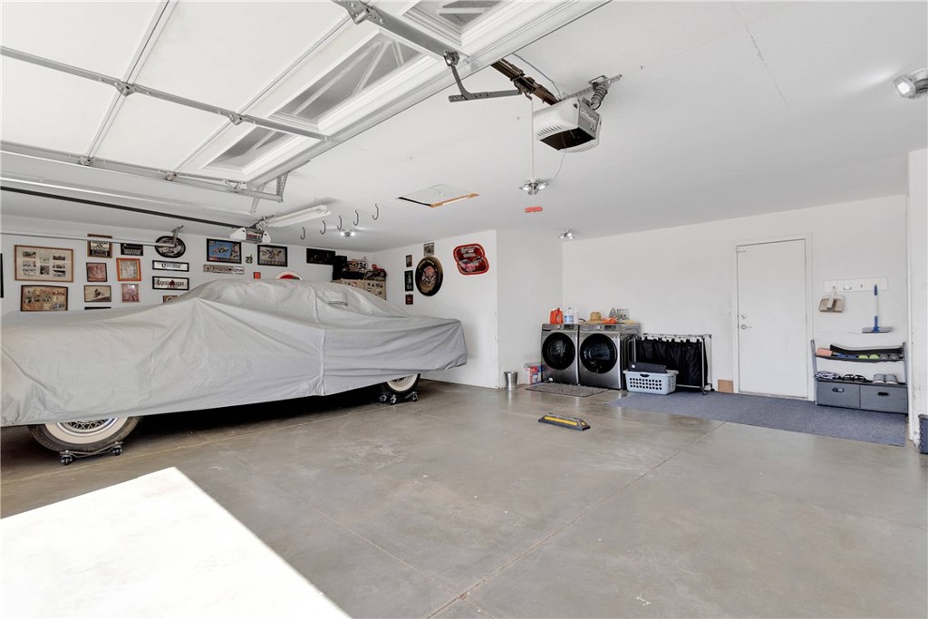8621 Aster Road Oak Hills, CA 92344 - Photo 32 of 54 a view of a livingroom with furniture and a ceiling fan