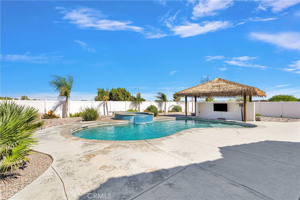 8621 Aster Road Oak Hills, CA 92344 - Photo 35 of 54 a front view of a house with a yard