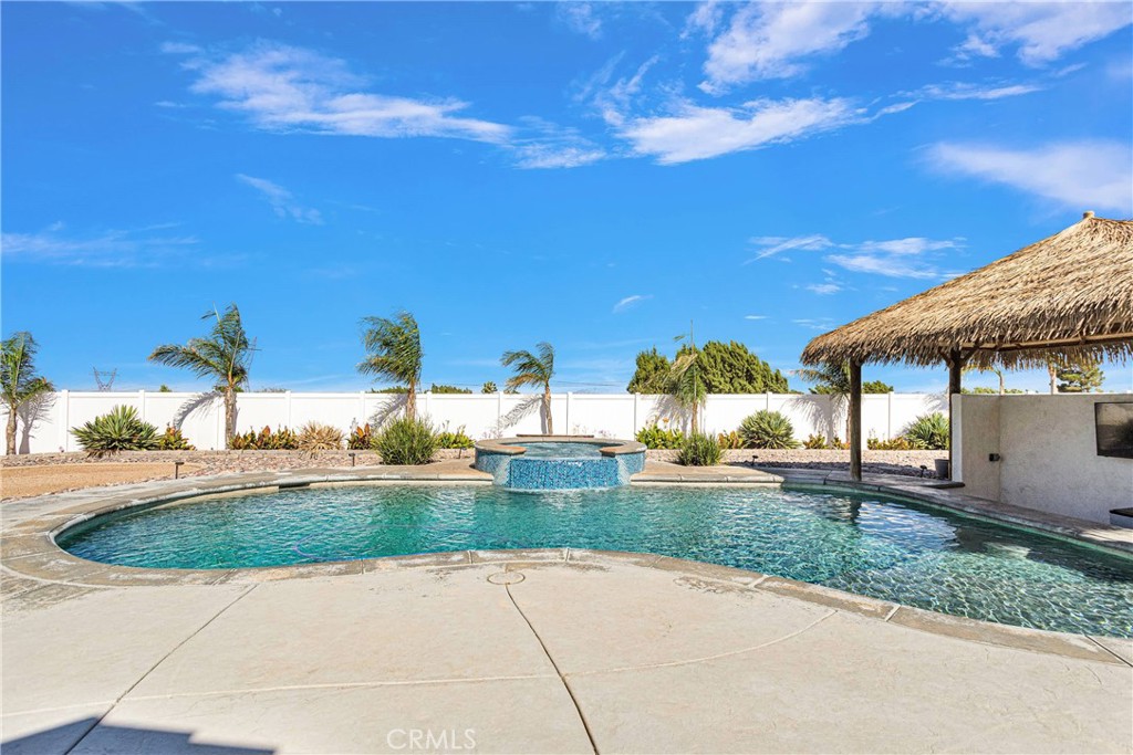 8621 Aster Road Oak Hills, CA 92344 - Photo 36 of 54 a front view of a house with garden