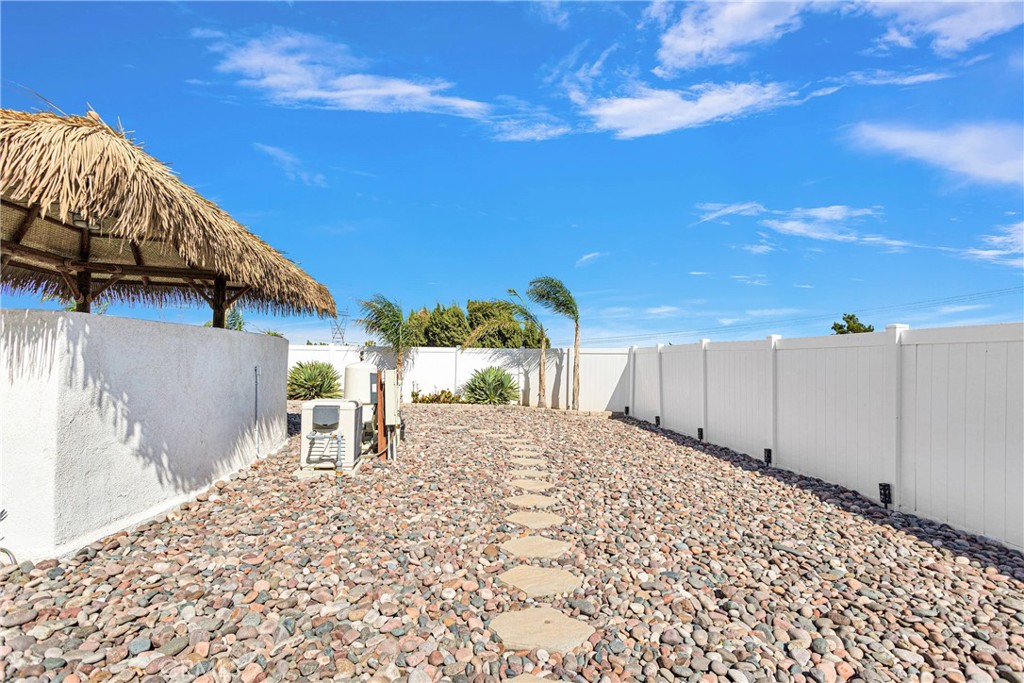 8621 Aster Road Oak Hills, CA 92344 - Photo 42 of 54 a view of a backyard with sitting area