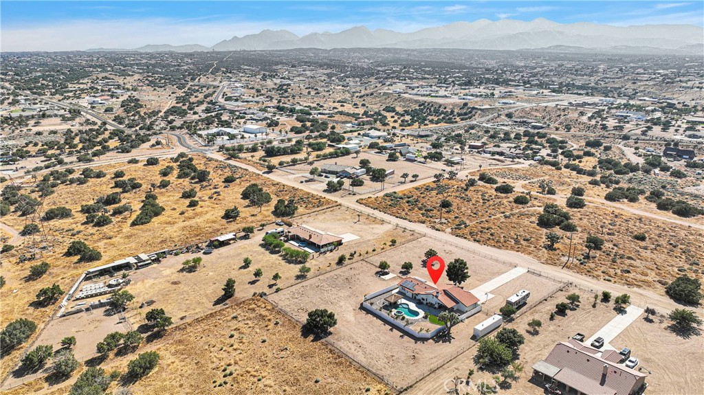 8621 Aster Road Oak Hills, CA 92344 - Photo 51 of 54 an aerial view of residential houses with outdoor space