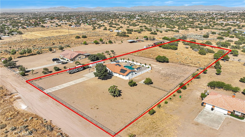 8621 Aster Road Oak Hills, CA 92344 - Photo 53 of 54 an aerial view of residential houses with outdoor space