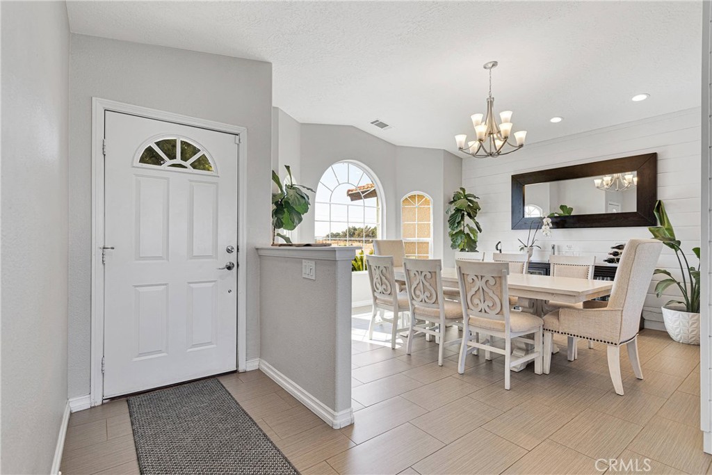 8621 Aster Road Oak Hills, CA 92344 - Photo 7 of 54 a view of a livingroom with furniture window and wooden floor