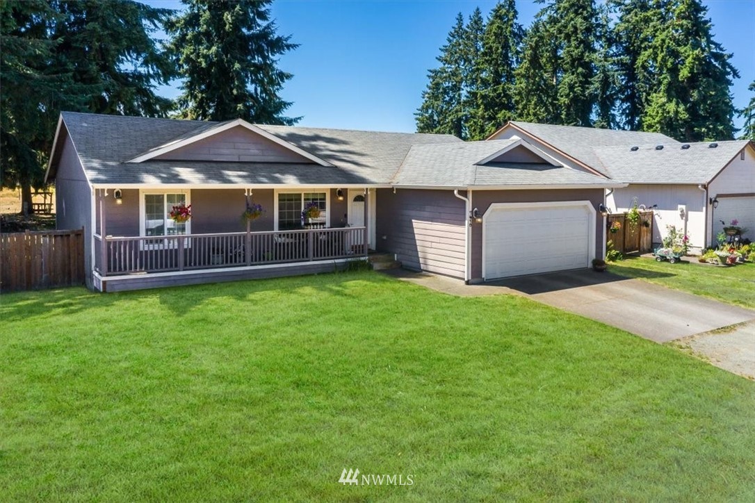 7610 187th Avenue Southwest Rochester, WA 98579 - Photo 1 of 39 a front view of a house with a garden