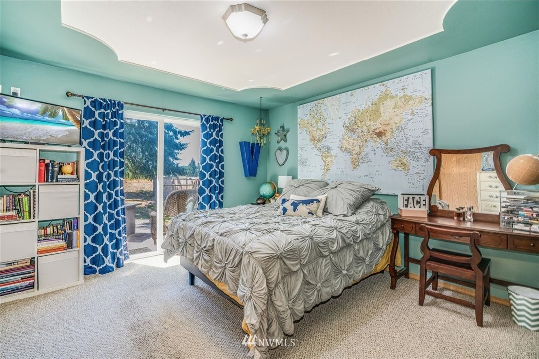 7610 187th Avenue Southwest Rochester, WA 98579 - Photo 20 of 39 a bedroom with a bed and a window