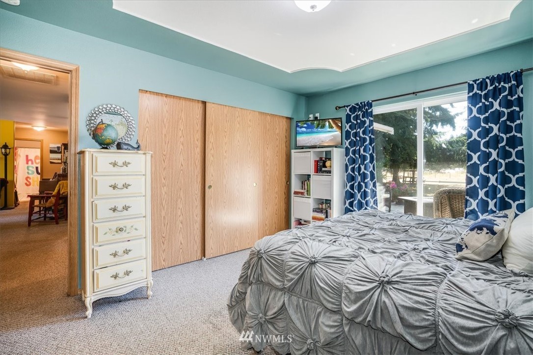 7610 187th Avenue Southwest Rochester, WA 98579 - Photo 22 of 39 a bedroom with a bed and a window
