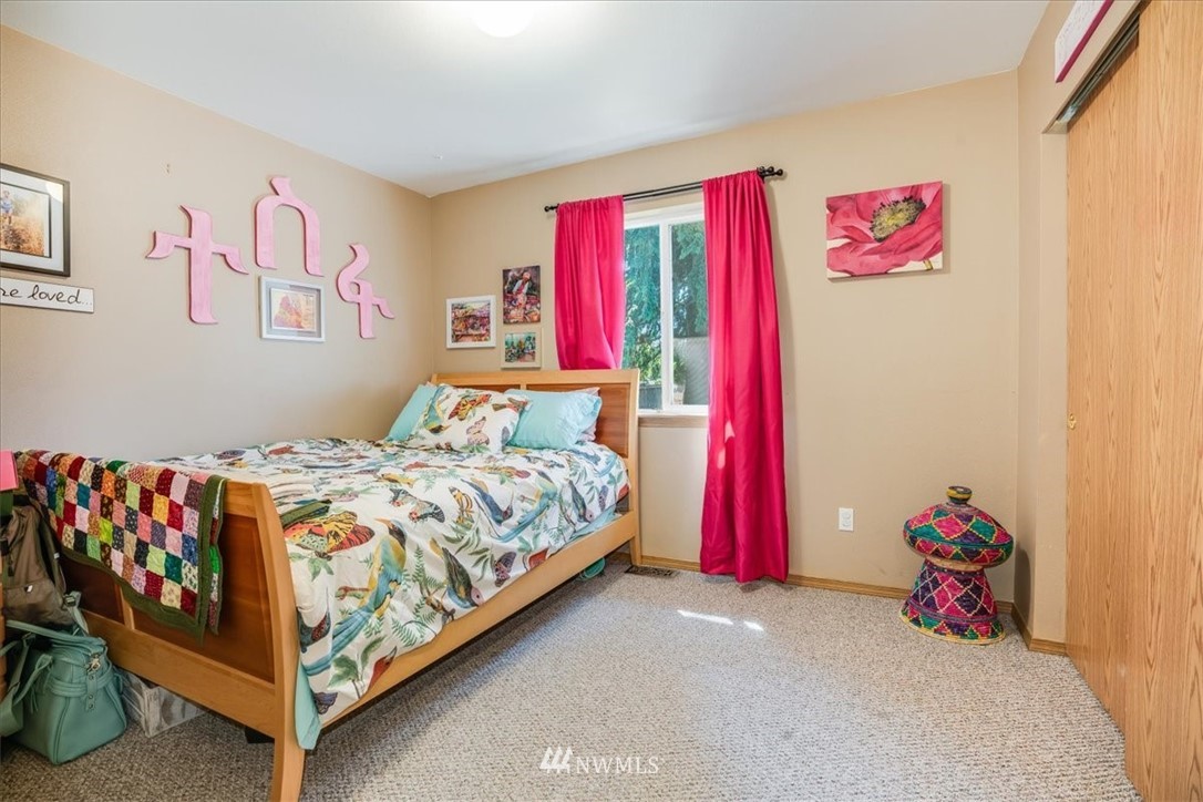 7610 187th Avenue Southwest Rochester, WA 98579 - Photo 24 of 39 a bedroom with a bed and a couch