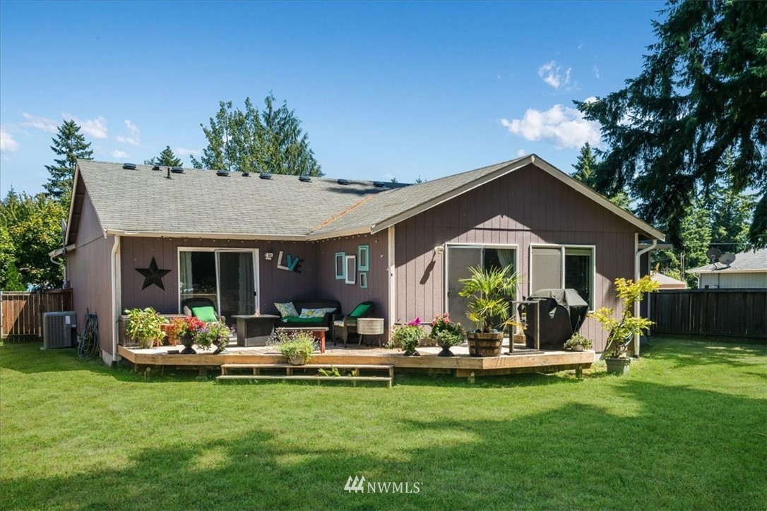 7610 187th Avenue Southwest Rochester, WA 98579 - Photo 29 of 39 a front view of house with yard and outdoor seating