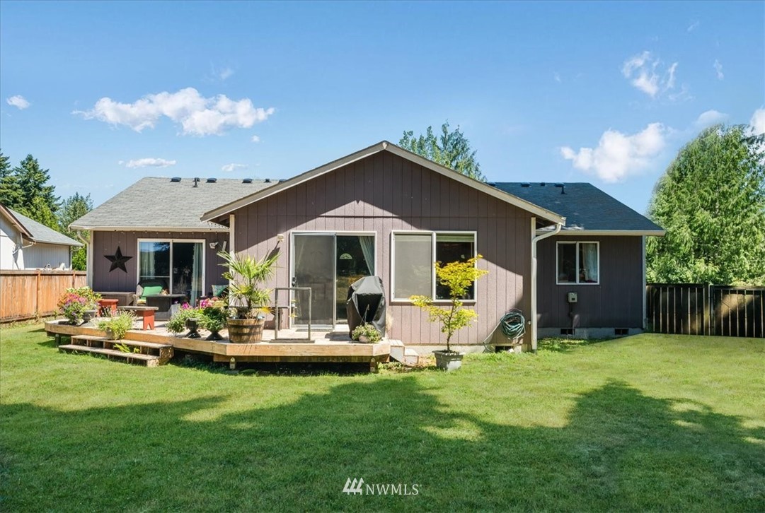 7610 187th Avenue Southwest Rochester, WA 98579 - Photo 30 of 39 a front view of house with yard and outdoor seating