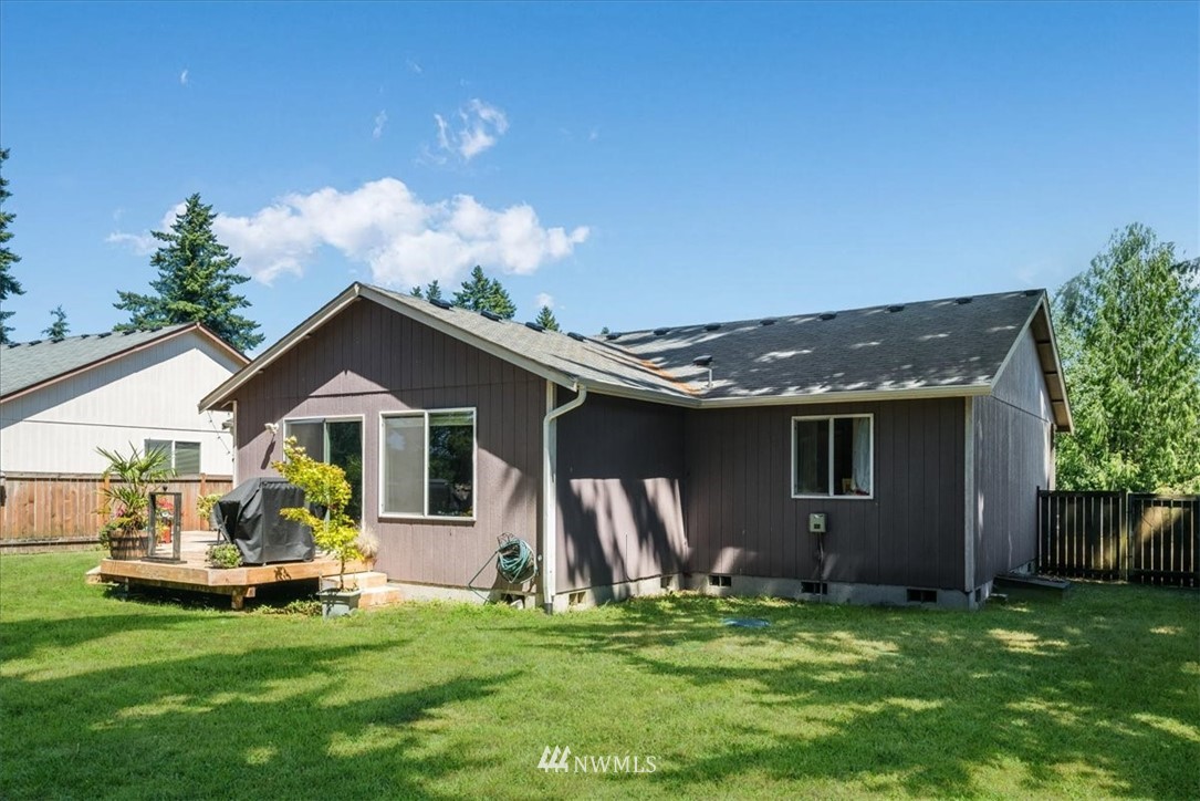 7610 187th Avenue Southwest Rochester, WA 98579 - Photo 31 of 39 a view of a house with a yard and sitting area