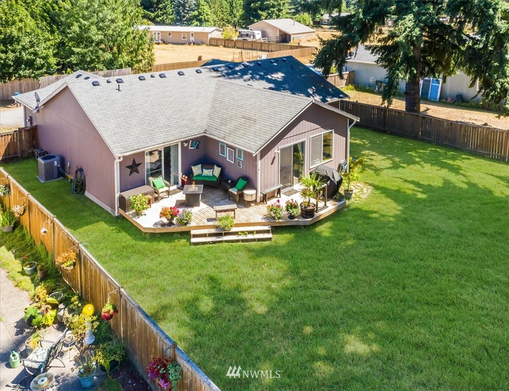 7610 187th Avenue Southwest Rochester, WA 98579 - Photo 35 of 39 a aerial view of a house with swimming pool garden and patio