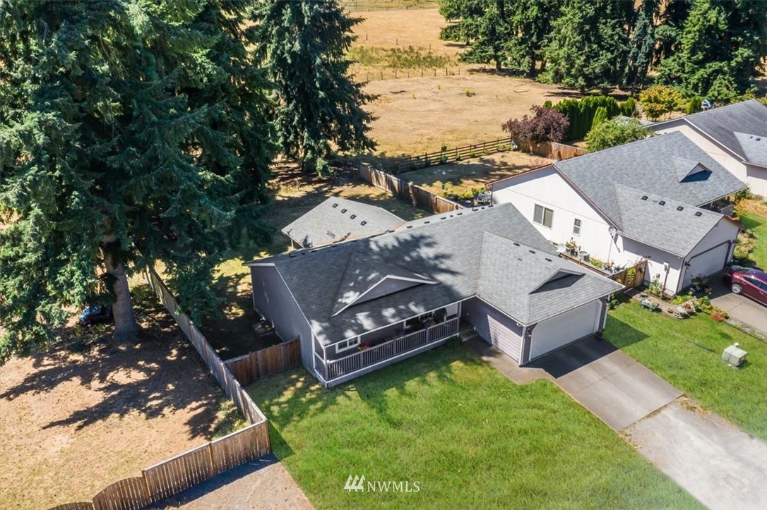7610 187th Avenue Southwest Rochester, WA 98579 - Photo 38 of 39 an aerial view of a house with garden space and street view