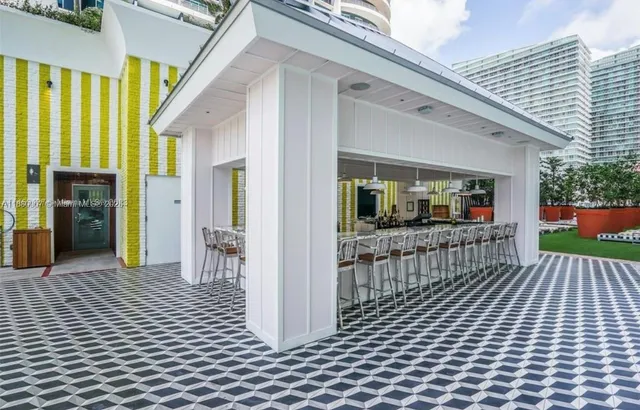 a view of a house with sitting area and garden