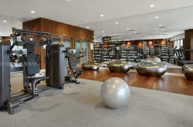 a media room with lots of chairs and a projector screen