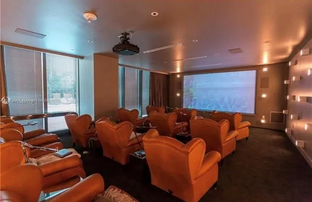 an outdoor sitting area with an umbrella