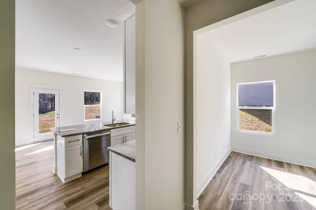 a kitchen with a stove and a sink