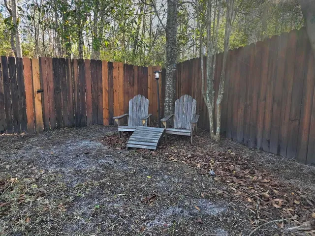 a view of outdoor space with wooden fence