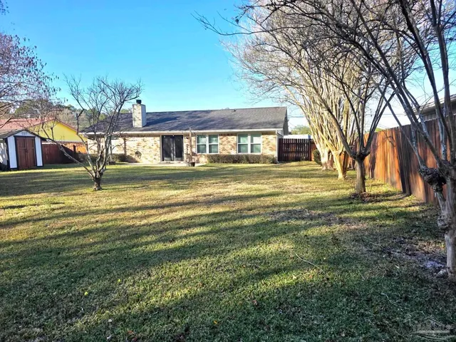 a view of a house with a big yard