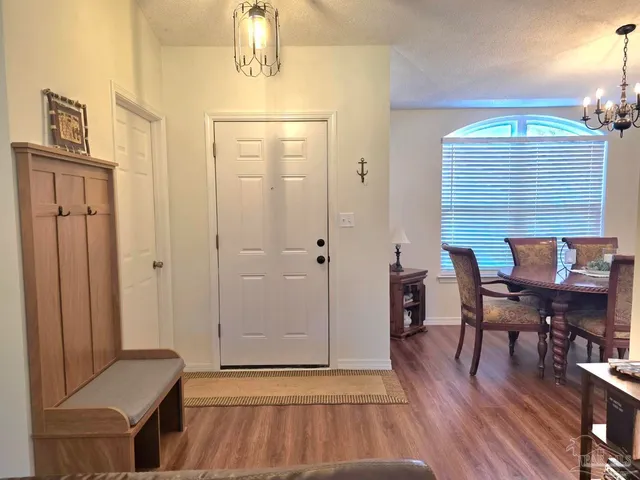 a view of a livingroom with furniture and wooden floor