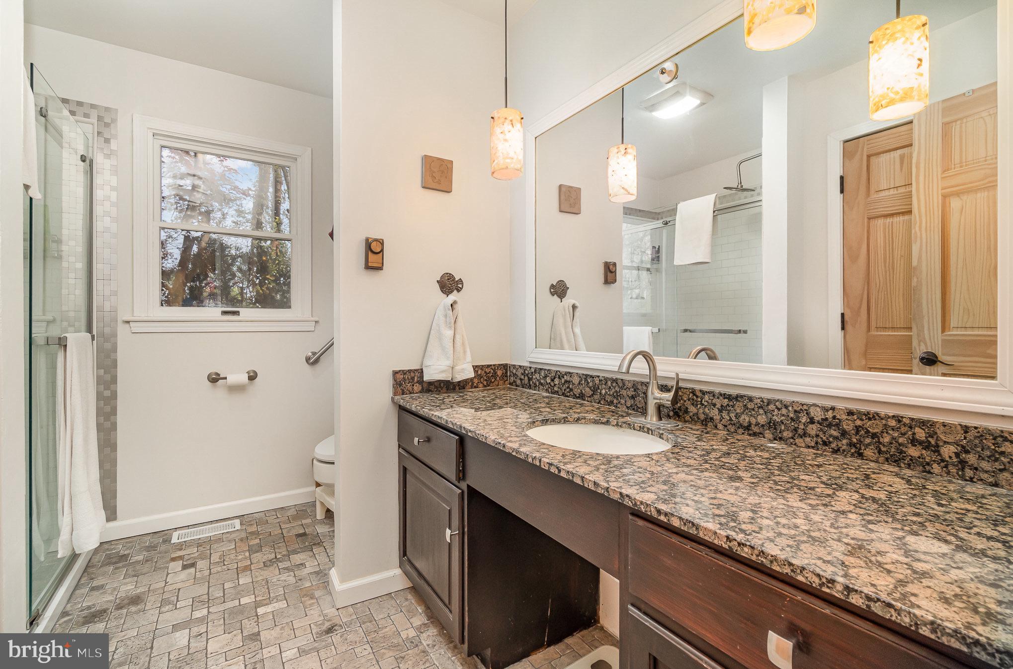 99 Fogelsanger Road Shippensburg, PA 17257 - Photo 24 of 55 a bathroom with a granite countertop sink and a mirror