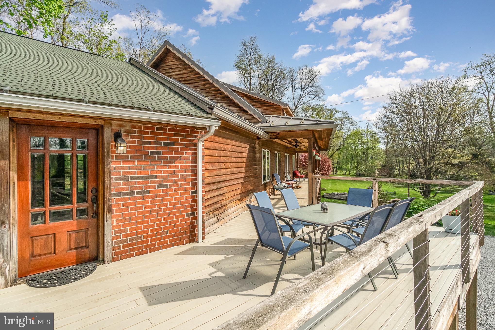 99 Fogelsanger Road Shippensburg, PA 17257 - Photo 47 of 55 a view of a patio with a table and chairs