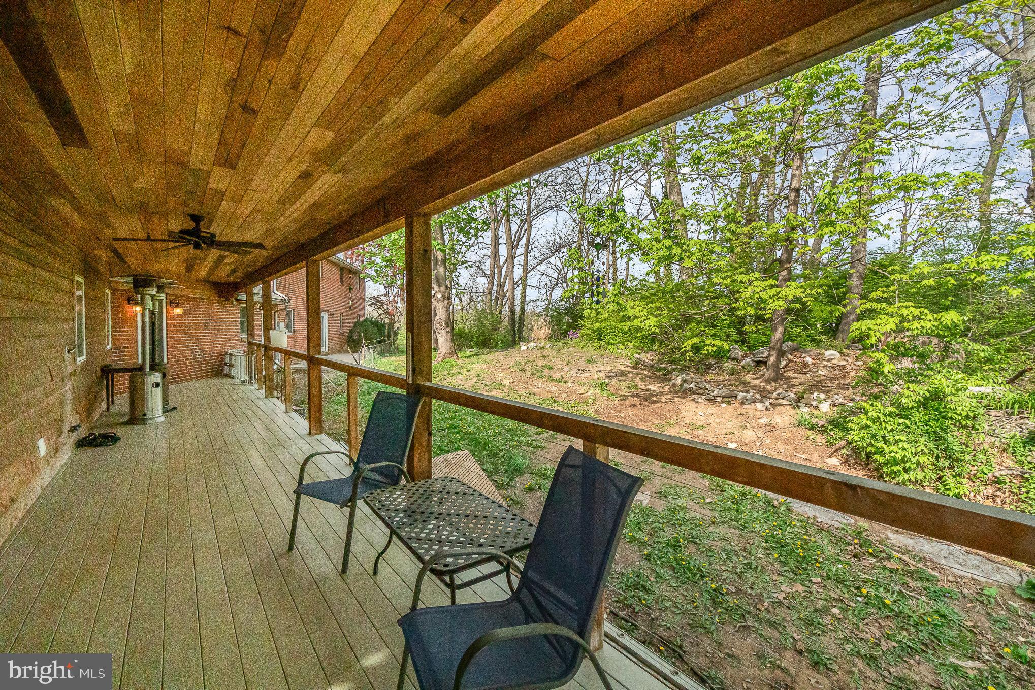 99 Fogelsanger Road Shippensburg, PA 17257 - Photo 48 of 55 a view of a porch with furniture and wooden floor