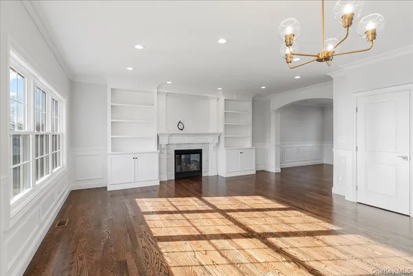 a view of livingroom with kitchen and fireplace