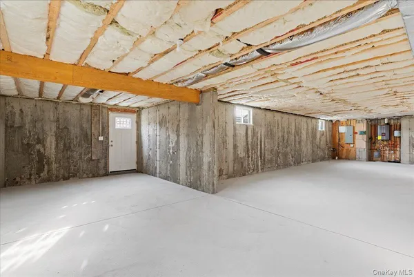 a view of a room with wooden walls