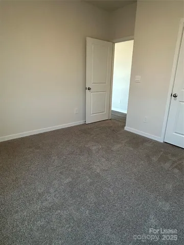 an empty room with closet area