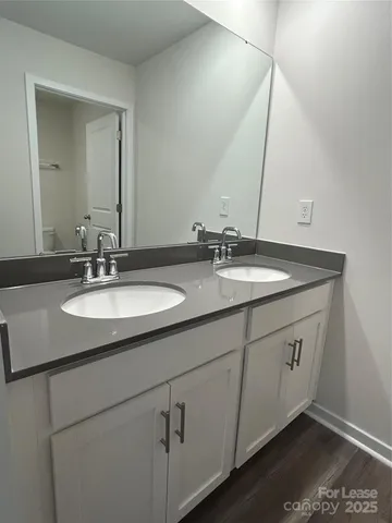 an empty room with a empty space and windows