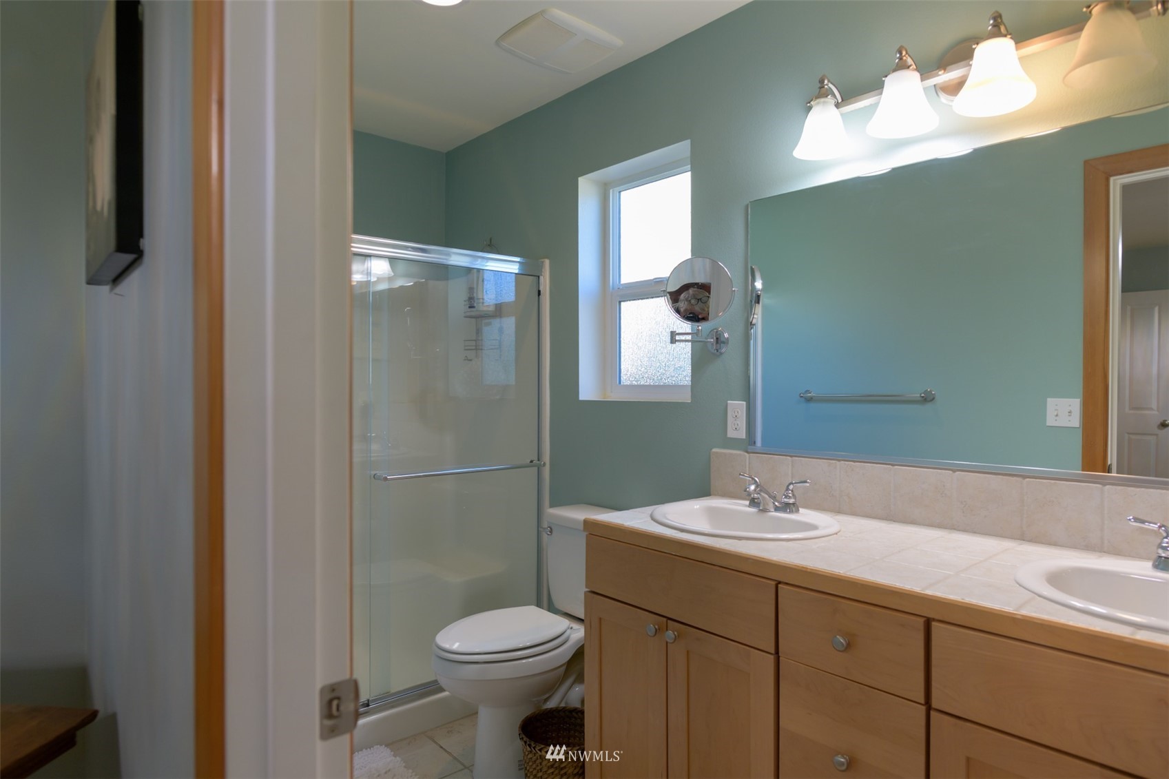 713 Sylvan Way Bremerton, WA 98310 - Photo 11 of 32 a bathroom with a sink toilet and shower