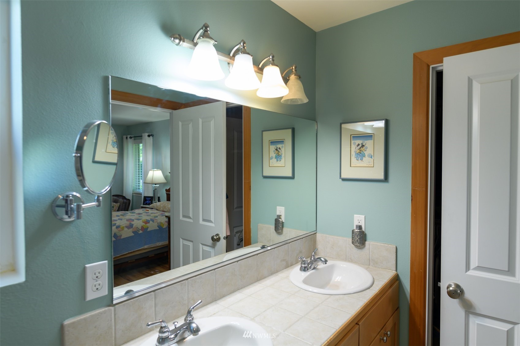 713 Sylvan Way Bremerton, WA 98310 - Photo 12 of 32 a bathroom with a sink vanity and a mirror
