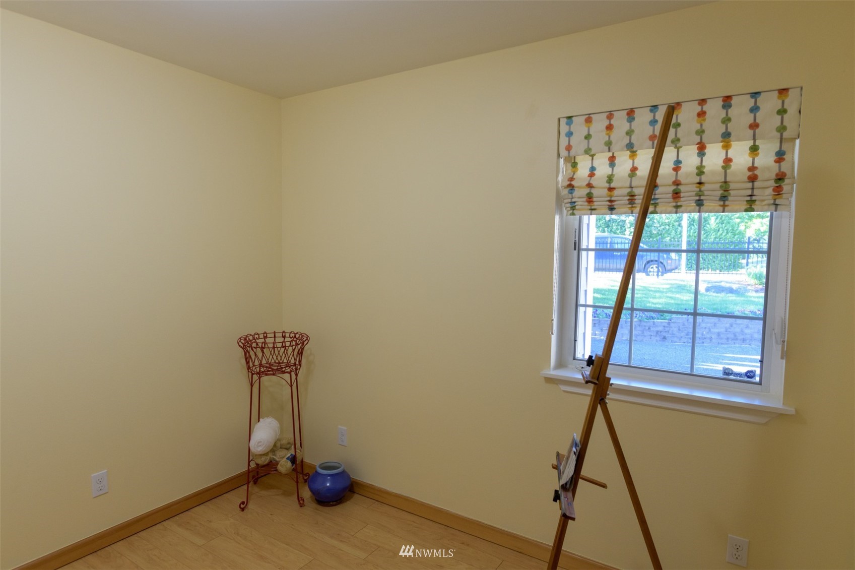 713 Sylvan Way Bremerton, WA 98310 - Photo 16 of 32 a view of room with window and wooden floor