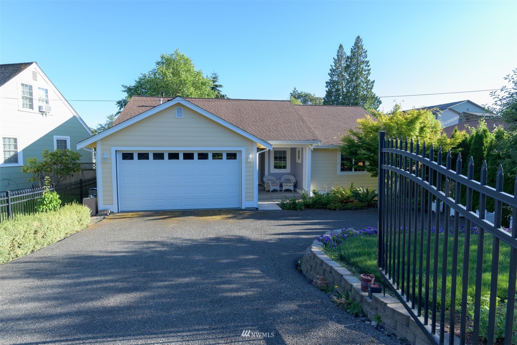 713 Sylvan Way Bremerton, WA 98310 - Photo 24 of 32 a front view of a house with a yard and garage