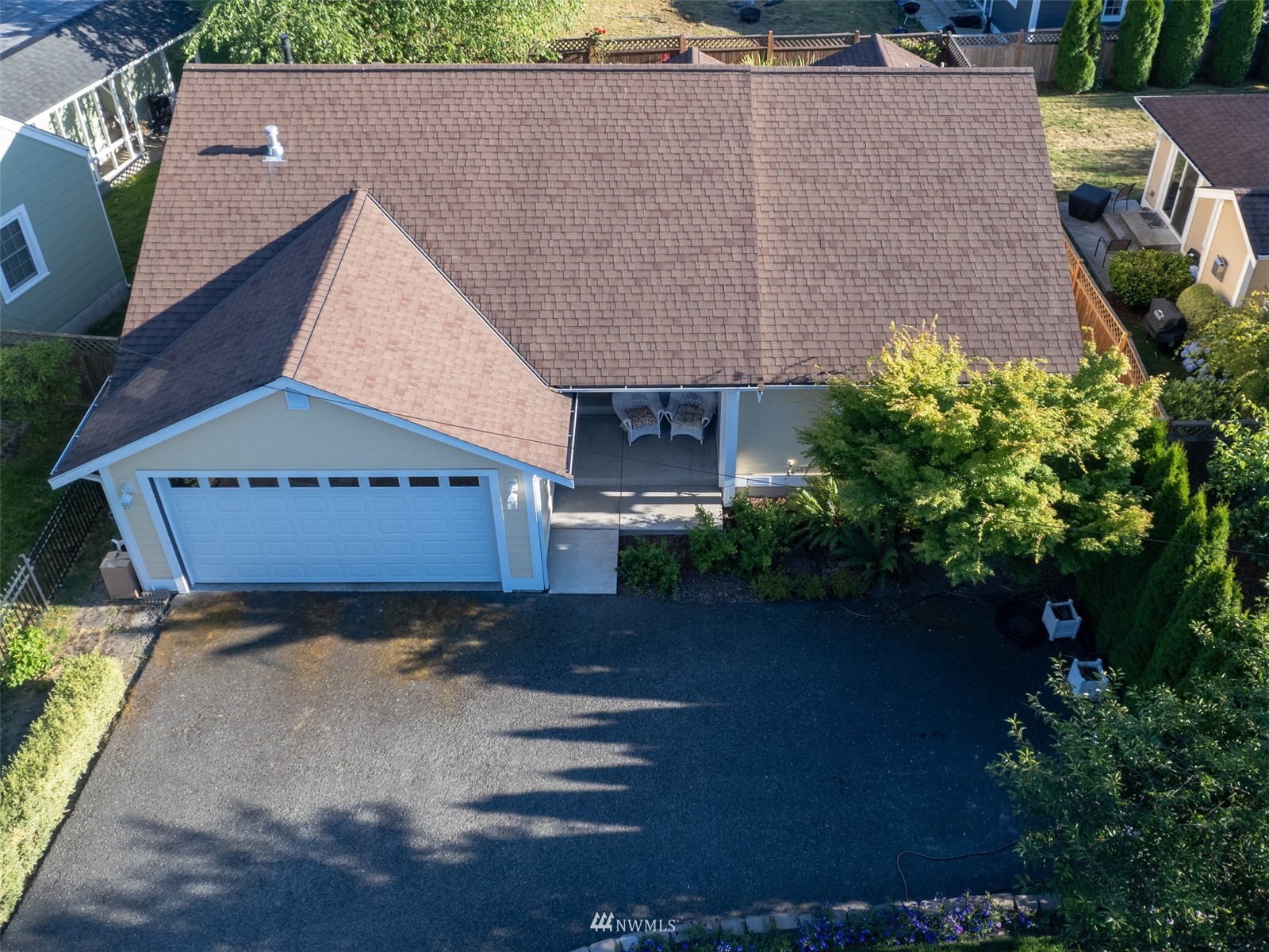 713 Sylvan Way Bremerton, WA 98310 - Photo 25 of 32 an aerial view of a house with garden space and a patio