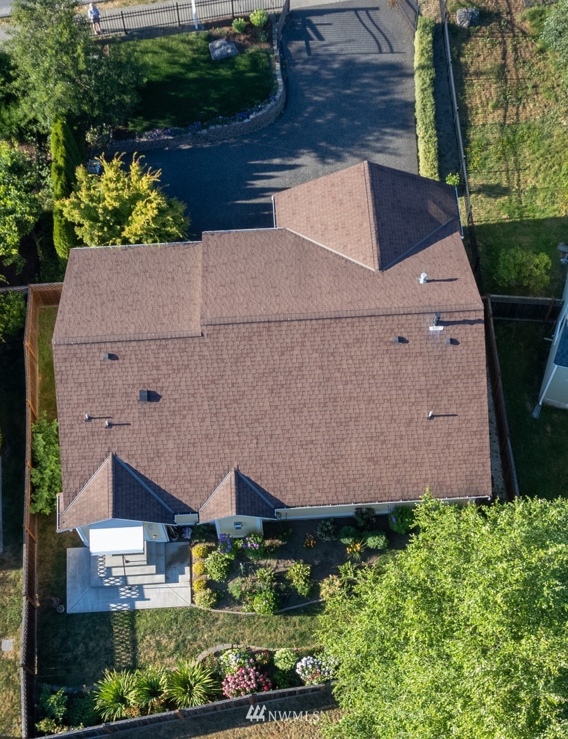 713 Sylvan Way Bremerton, WA 98310 - Photo 27 of 32 an aerial view of a house with a yard and garden