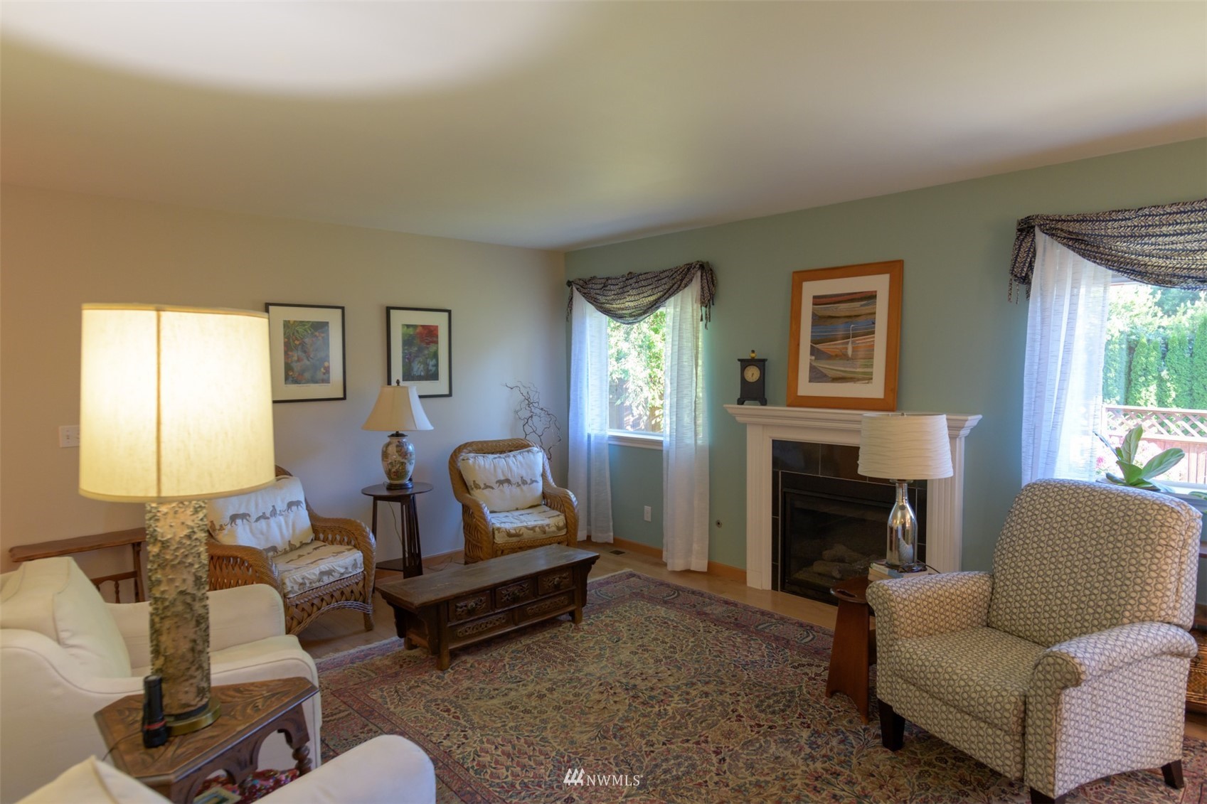 713 Sylvan Way Bremerton, WA 98310 - Photo 3 of 32 a living room with furniture or couch and a fireplace