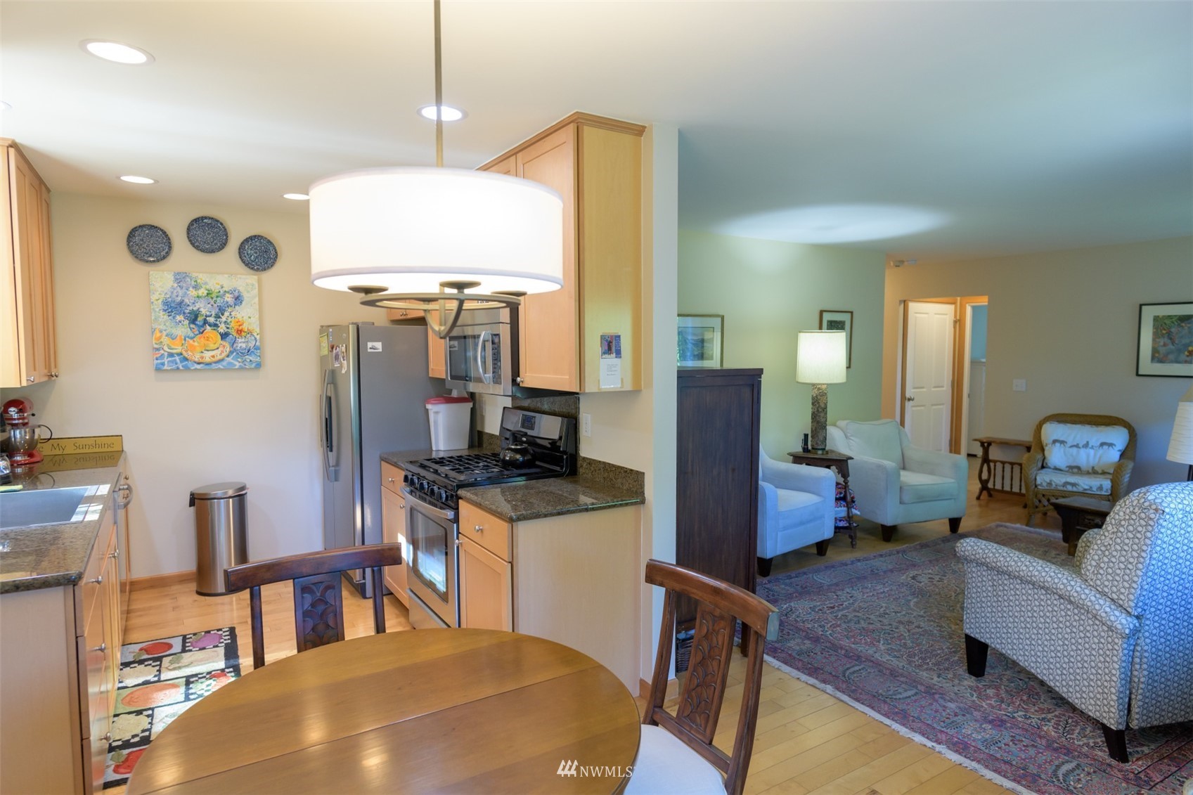 713 Sylvan Way Bremerton, WA 98310 - Photo 6 of 32 a kitchen with a refrigerator and a stove