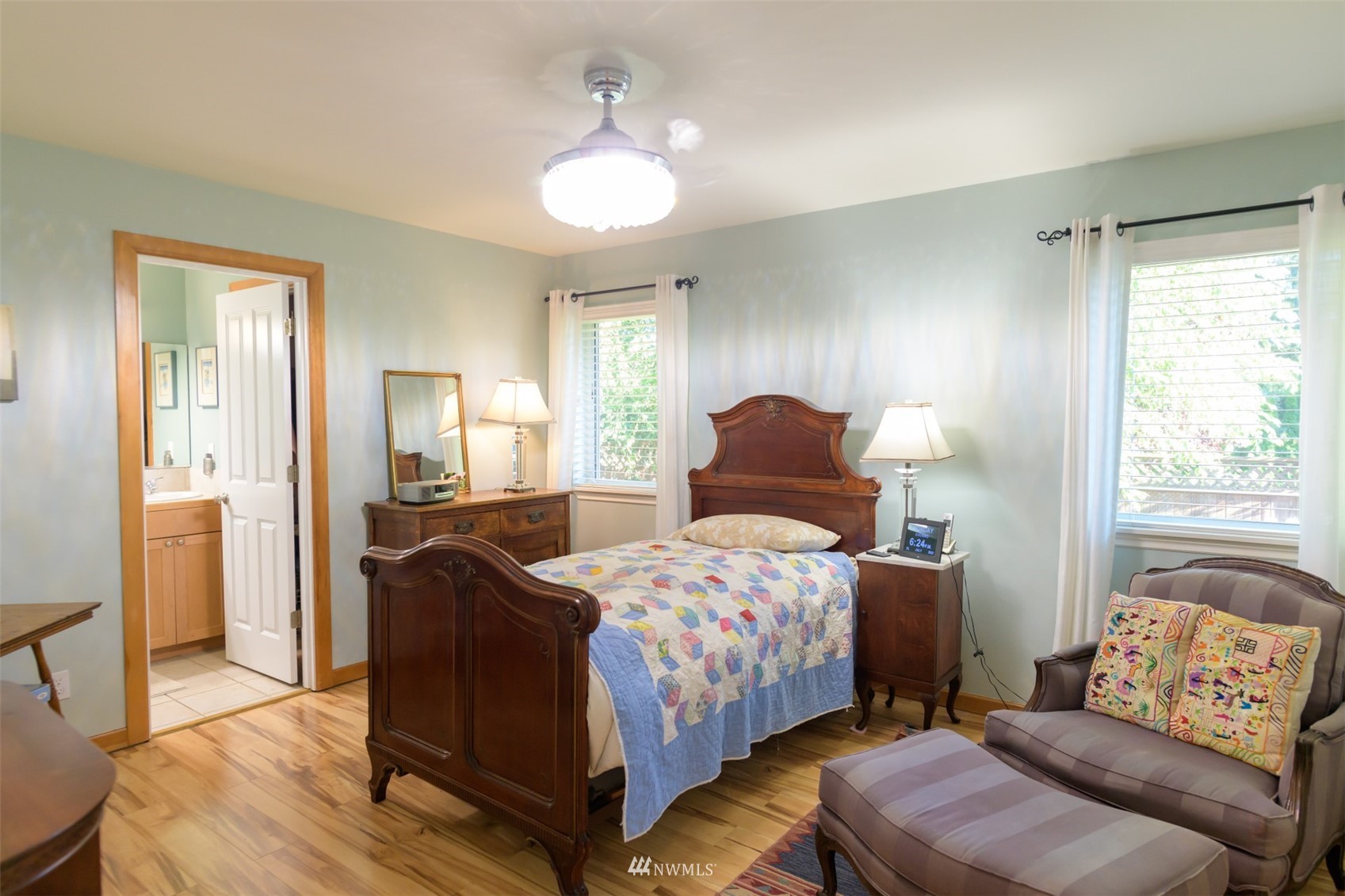 713 Sylvan Way Bremerton, WA 98310 - Photo 9 of 32 a bedroom with a bed and wooden floor