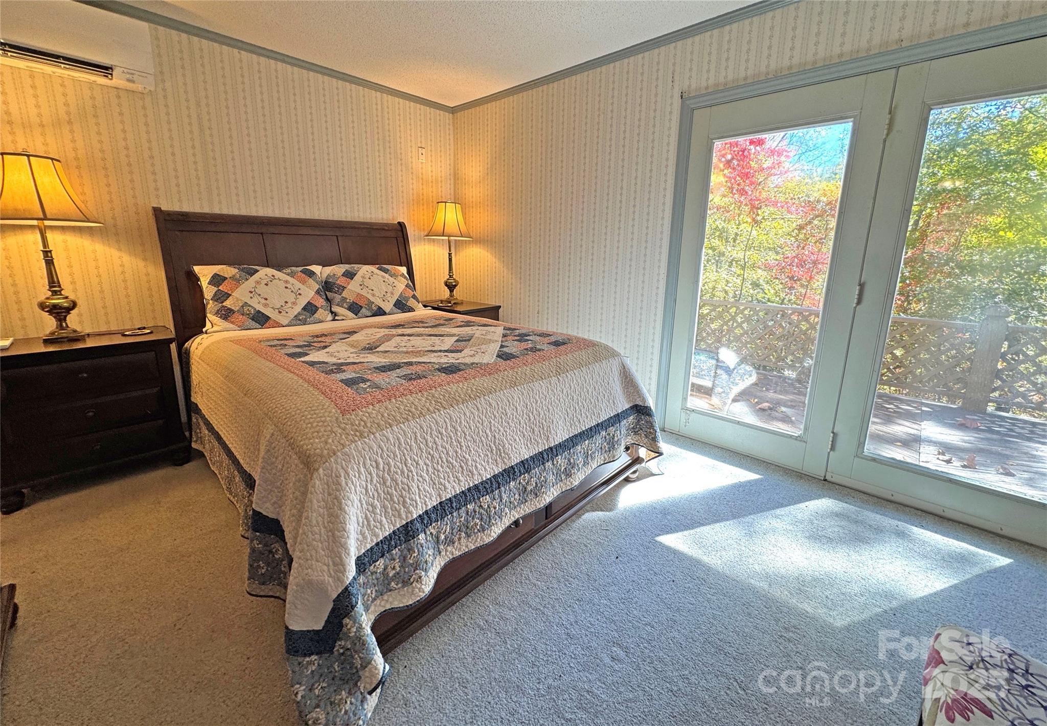 1622 Meadow Fork Road Hot Springs, NC 28743 - Photo 11 of 31 a bed sitting in a bedroom next to a window