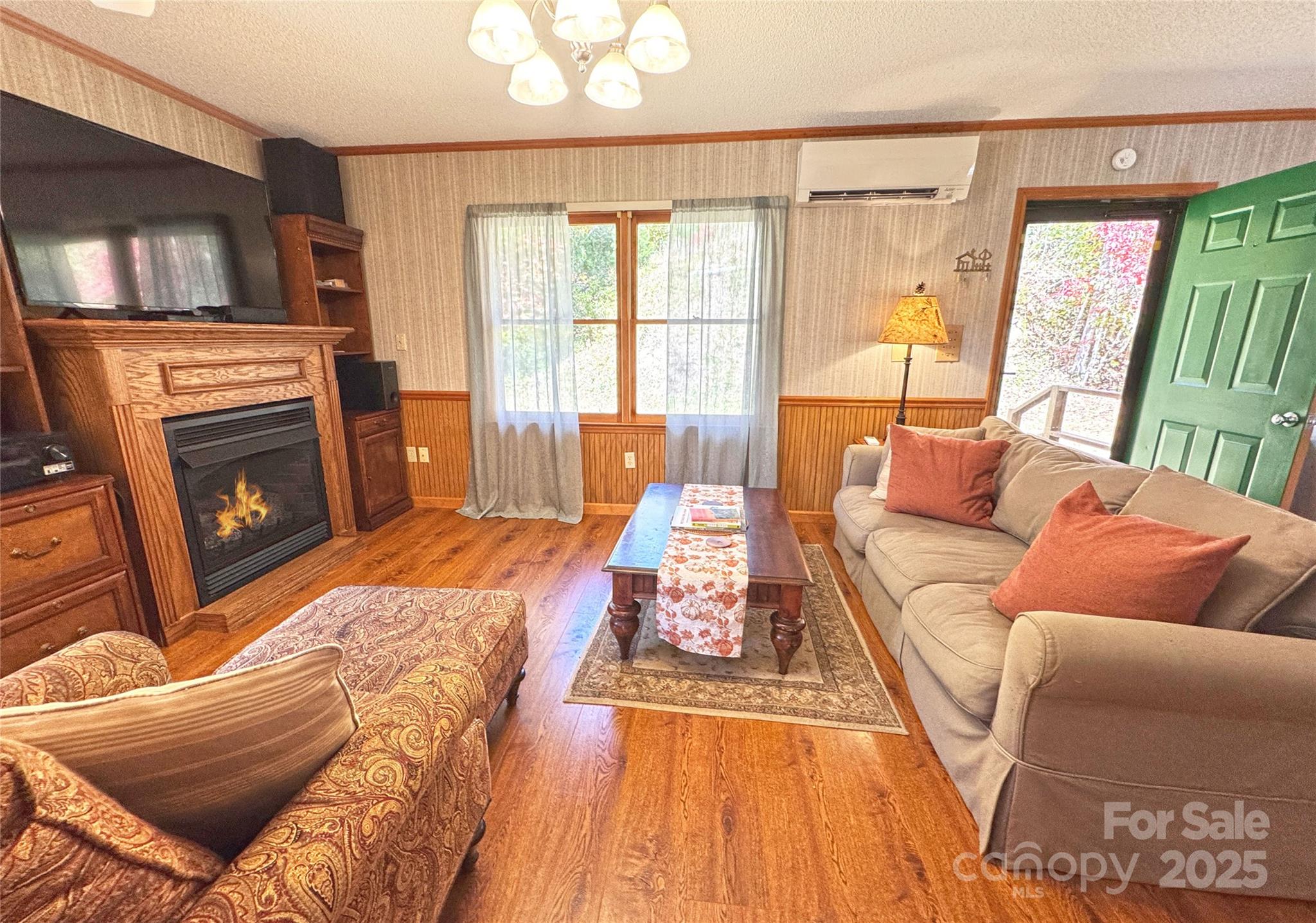 1622 Meadow Fork Road Hot Springs, NC 28743 - Photo 19 of 31 a living room with furniture and a fireplace