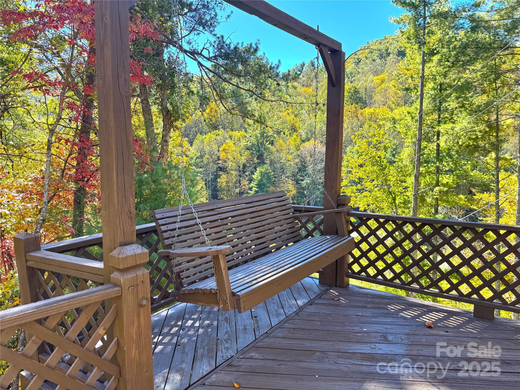 1622 Meadow Fork Road Hot Springs, NC 28743 - Photo 5 of 31 a view of a wooden bench next to a yard