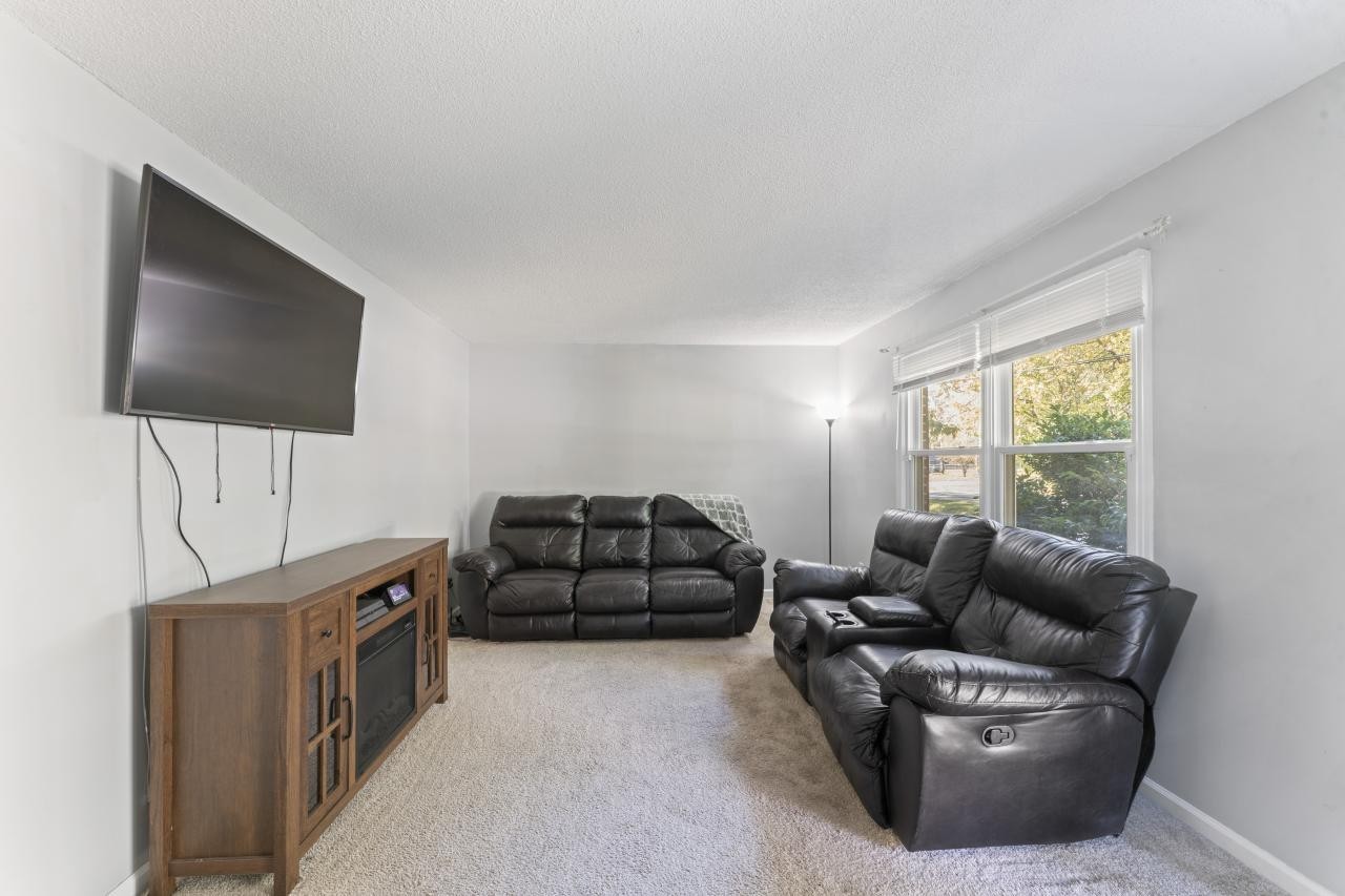 102 Aldrin Street Tullahoma, TN 37388 - Photo 11 of 21 a living room with furniture and a flat screen tv