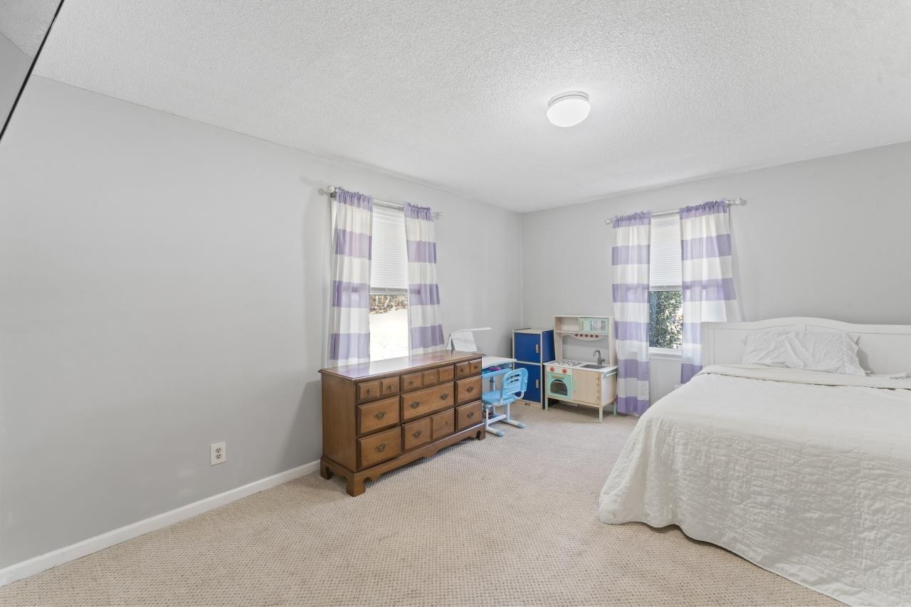102 Aldrin Street Tullahoma, TN 37388 - Photo 15 of 21 a bed room with a bed and a window