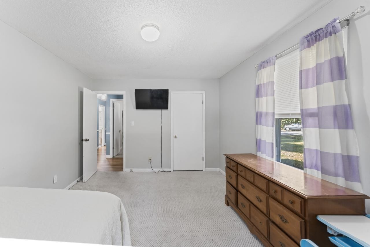 102 Aldrin Street Tullahoma, TN 37388 - Photo 16 of 21 a bedroom with a bed and a television