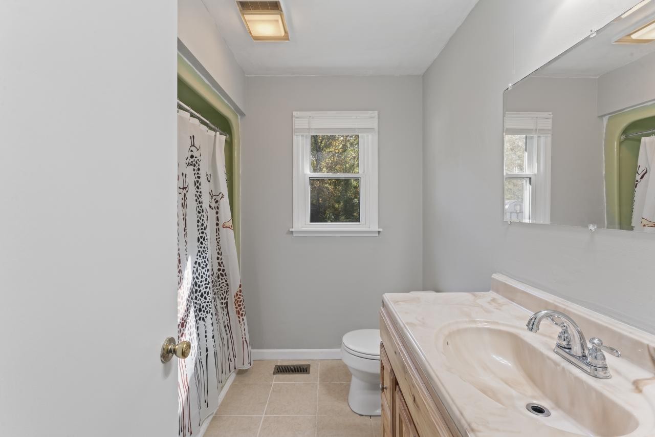 102 Aldrin Street Tullahoma, TN 37388 - Photo 18 of 21 a bathroom with a sink a toilet and shower