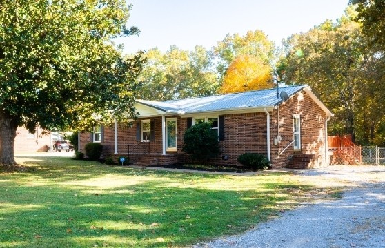 102 Aldrin Street Tullahoma, TN 37388 - Photo 4 of 21 a view of a house with a yard