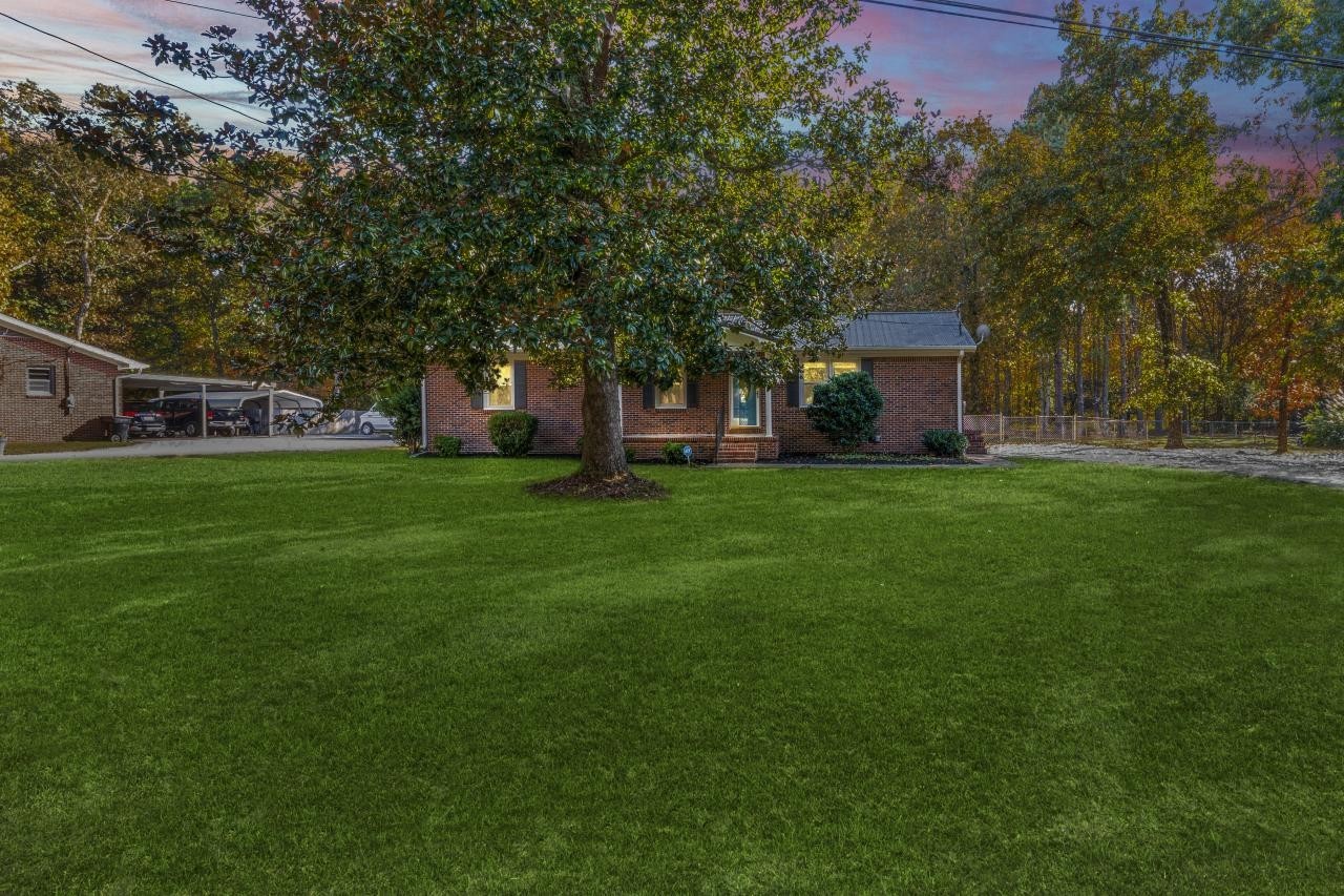 102 Aldrin Street Tullahoma, TN 37388 - Photo 9 of 21 a view of a tree in front of a house