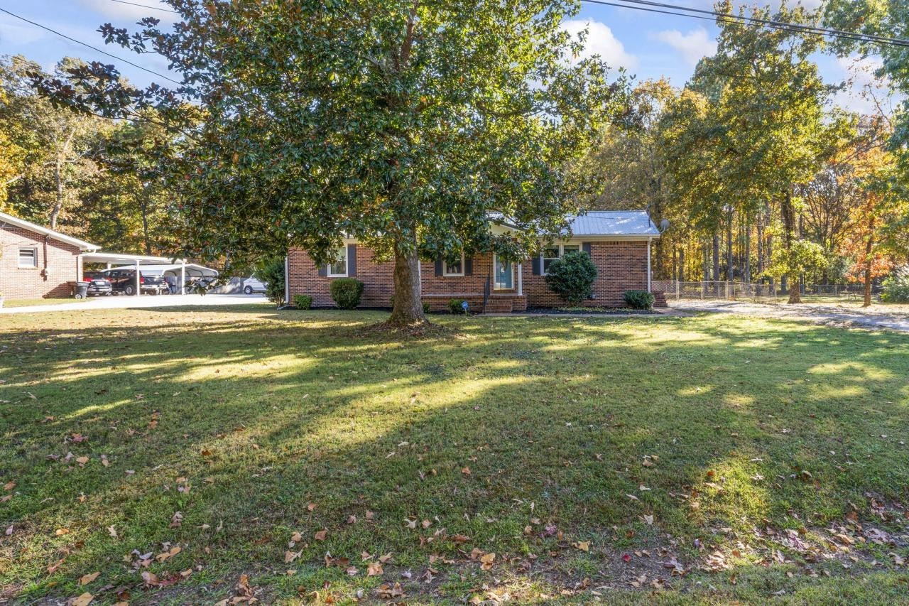 102 Aldrin Street Tullahoma, TN 37388 - Photo 10 of 21 a view of a house with a yard and sitting area