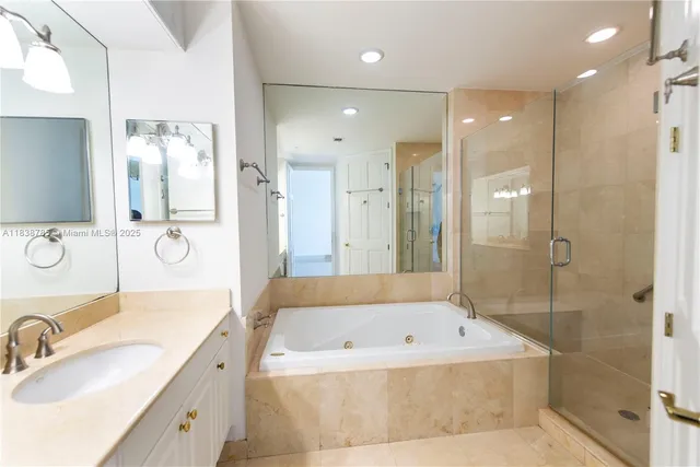 a bathroom with a toilet a sink and shower